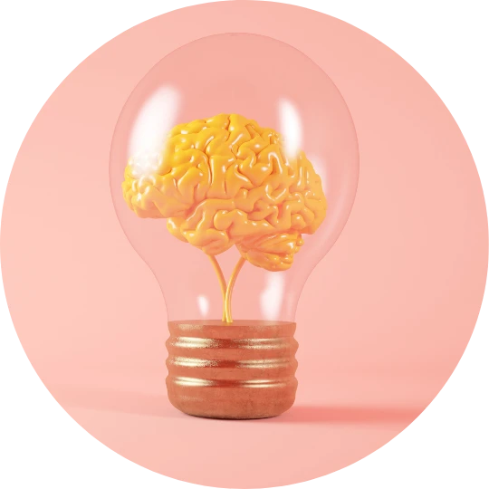 Photo d'une ampoule avec un cerveau à l'intérieur sur fond rose